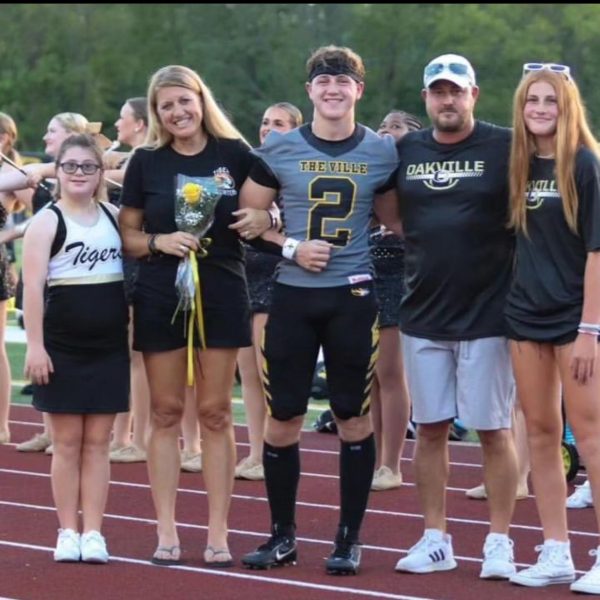 Joseph Romano (12) poses for photo with family on Senior Night. Im not big on leading by words, Im big on leading by example, Romano said.
Romano is attending Mizzous school of engineering and has been named an academic All-State football player for Oakville.