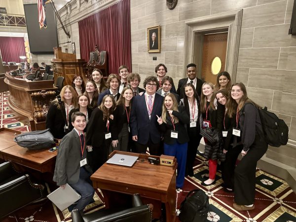 OHS Youth and Government members pose in the House in Jefferson City at the Clark Convention. “I’m looking forward to what other bills there will be next year,” Bryce Kesselring (12) said. “Im also really looking forward to seeing Owen since hes speaker next year, and Im looking forward to seeing how he does in that role.” Owen Mellinger (11) plans to try his best as a leader to implement himself into the role and connect with everyone next year. 