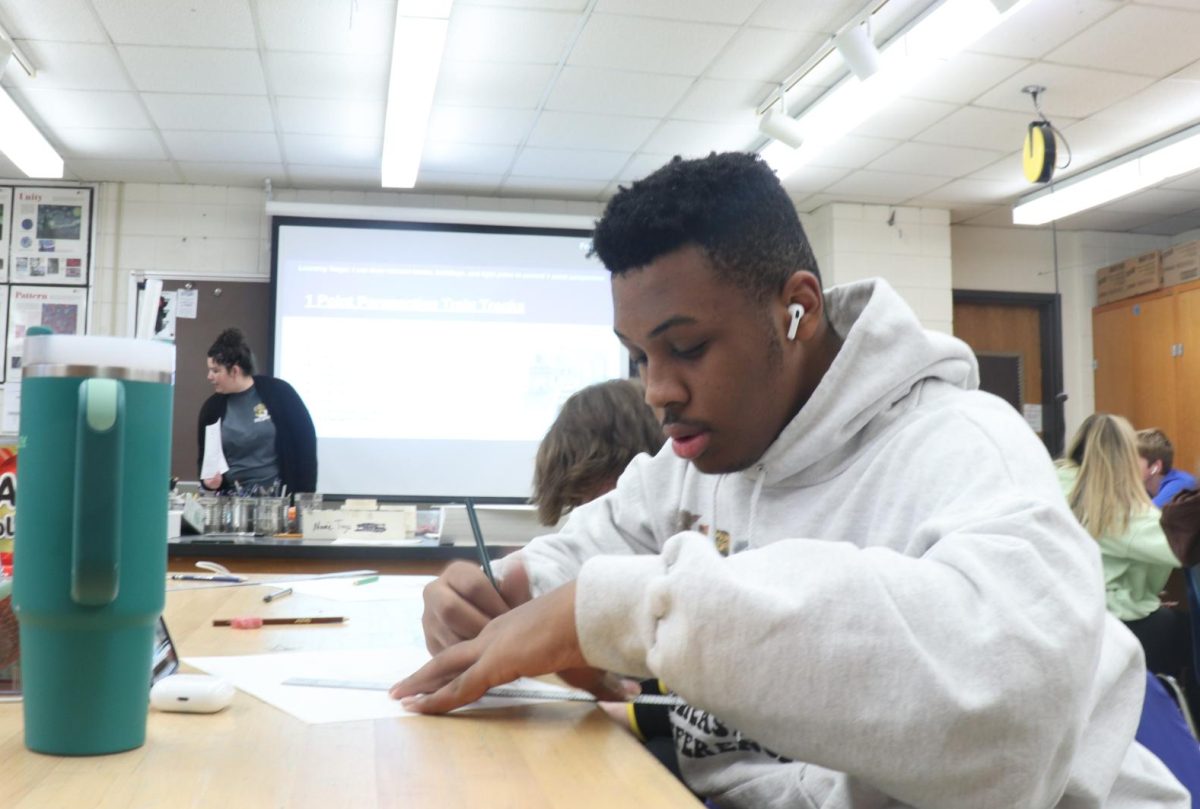 Travis Norris (12) works on an assignment for his class. I have had a pretty good high school experience. I think it’s time for something new, Norris said. Norris will attend STLCC second semester. 