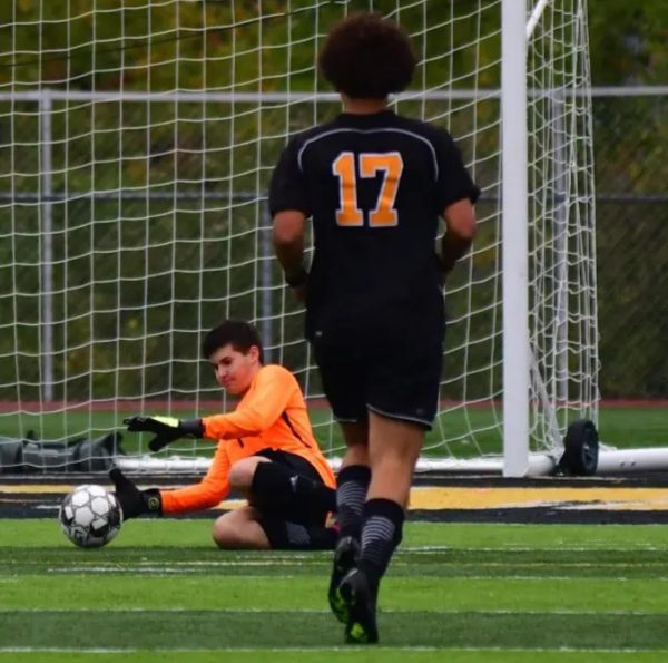 Soccer player Jaxon Schnurr (9) attempts to score a goal in an OHS game. When I score a goal in soccer, its a great feeling and I am filled with love and passion for the sport, Schnurr said. Schnurr has had a passion for soccer ever since he began playing. 