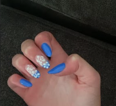 Ollie Scholz (9) designs her nails. “Doing nails was so fun, so eventually I started doing my mom’s nails,” Scholz said. “...And as Ive gotten better, I started to do my friends and people from school.” Scholz even makes money from doing people nails. 

