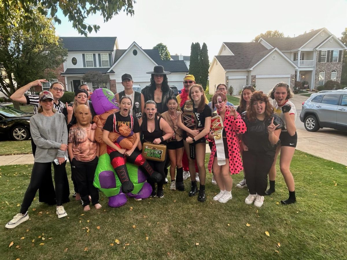 Heidi Niedermann (12) celebrates her eighteenth birthday with friends and family. I loved how everyone dressed up and gave it their all for me, Niedermann said. She also had wrestling themed food at the party, playing on their names for the dishes.