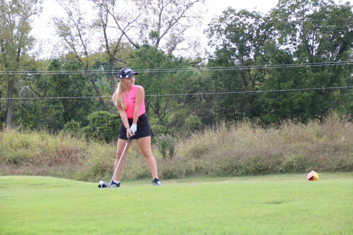 Via Wideman (11) and Ava Ross (11) play in a golf match. “…This is a sport that I can play my whole entire life,” Ross said. Wideman added that her favorite parts of playing golf were the community and her teammates.