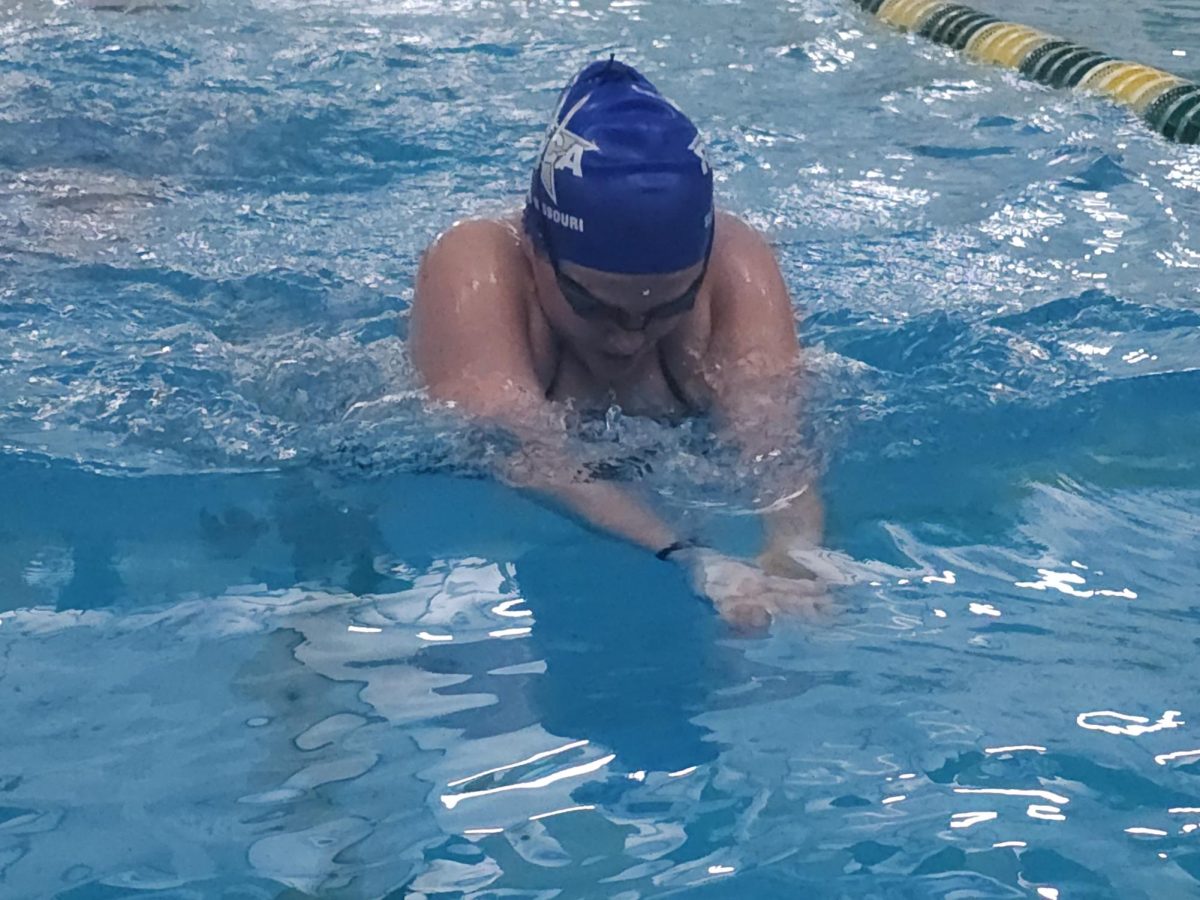 On Nov. 21, Isabella Poertner (10) practices her breaststroke at Lindbergh's pool since Mehlville's pool is closed for the season due to renovations. "Liska...figured out how to split up practices...to put swimmers where they need to be," Poertner said. She also mentioned that the pool often gets crowded with other teams practicing.