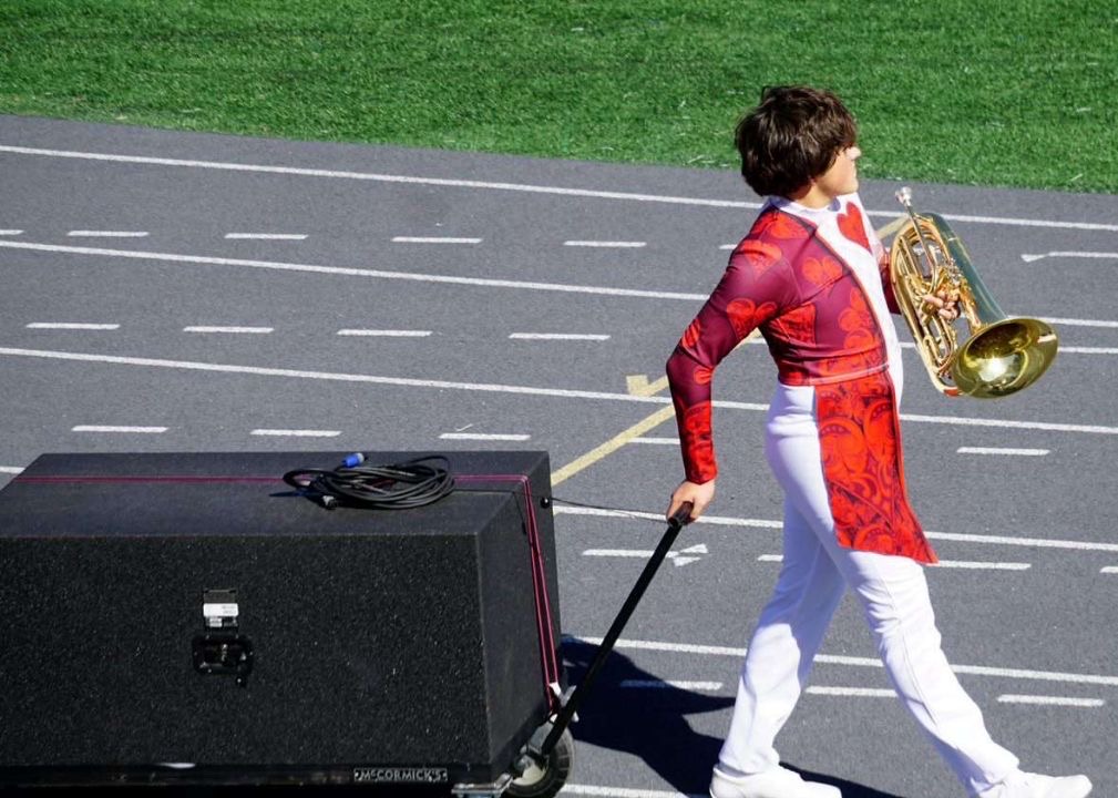 Landon Cernich (10) prepares to march during a performance on Oct. 13, 2024 at a OHS football game. “I really liked our show this year,” Cernich said. “I think that the audience did too.” These performances prepared Cernich for his upcoming All-Suburban tryouts.