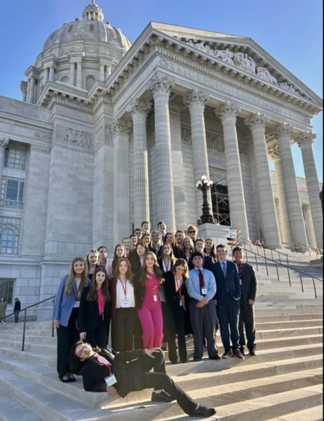 Students involved in the Oakville delegation of Youth and Government pose in front of the State Capitol building. "I would say that we have all gotten really close as a group, even if there are only three of us who are original members as of right now," Zoe Simeral (12) said. Simeral added that the group has definitely grown throughout its duration at OHS.