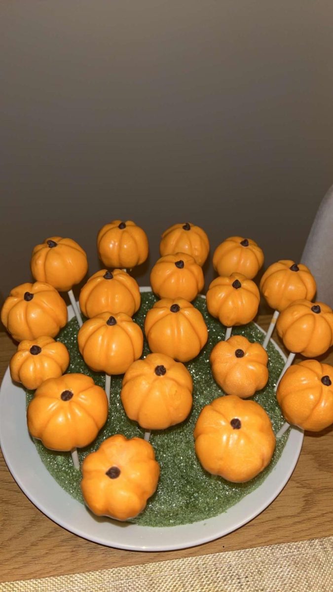Pumpkin cake pops made by freshman Erin Zupka are on display. "I like using hard recipies because I like a challenge," Zupka said. She also looked forward to seeing how far she could get into baking.