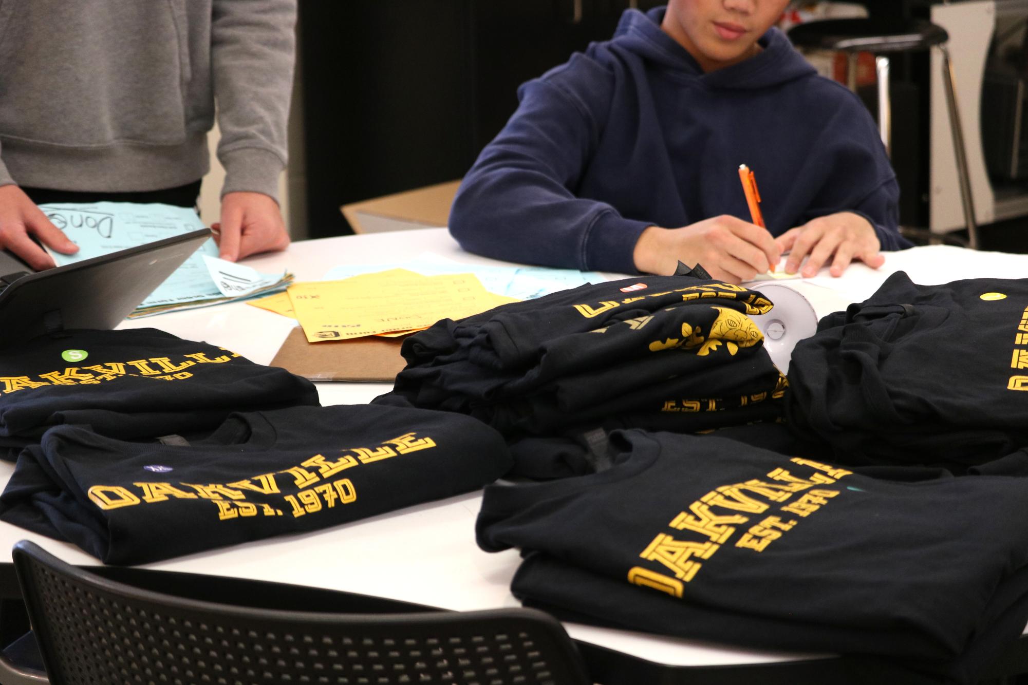 Students in the Entrepreneurship class create and package orders. "I would recommend taking this class if you want to get into sales, marketing products, understanding how a business works and get a sense of what it feels like," Humza Arain (11) said. "At first it's stressful, but over time, you take away big things." The students worked hard to successfully package and deliver orders. 