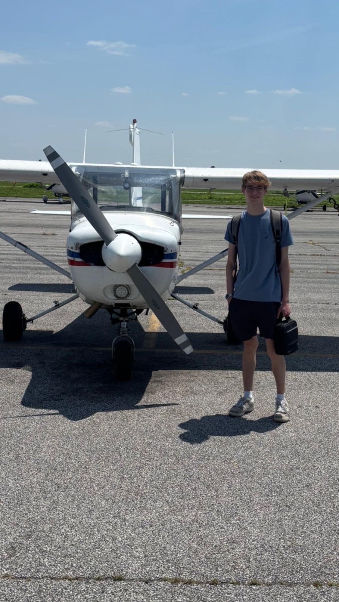 Ethan Black (11) stands in front of a plane he is about to fly over the summer. "Flying is freeing," Black said. This was the plane Black usually flies.