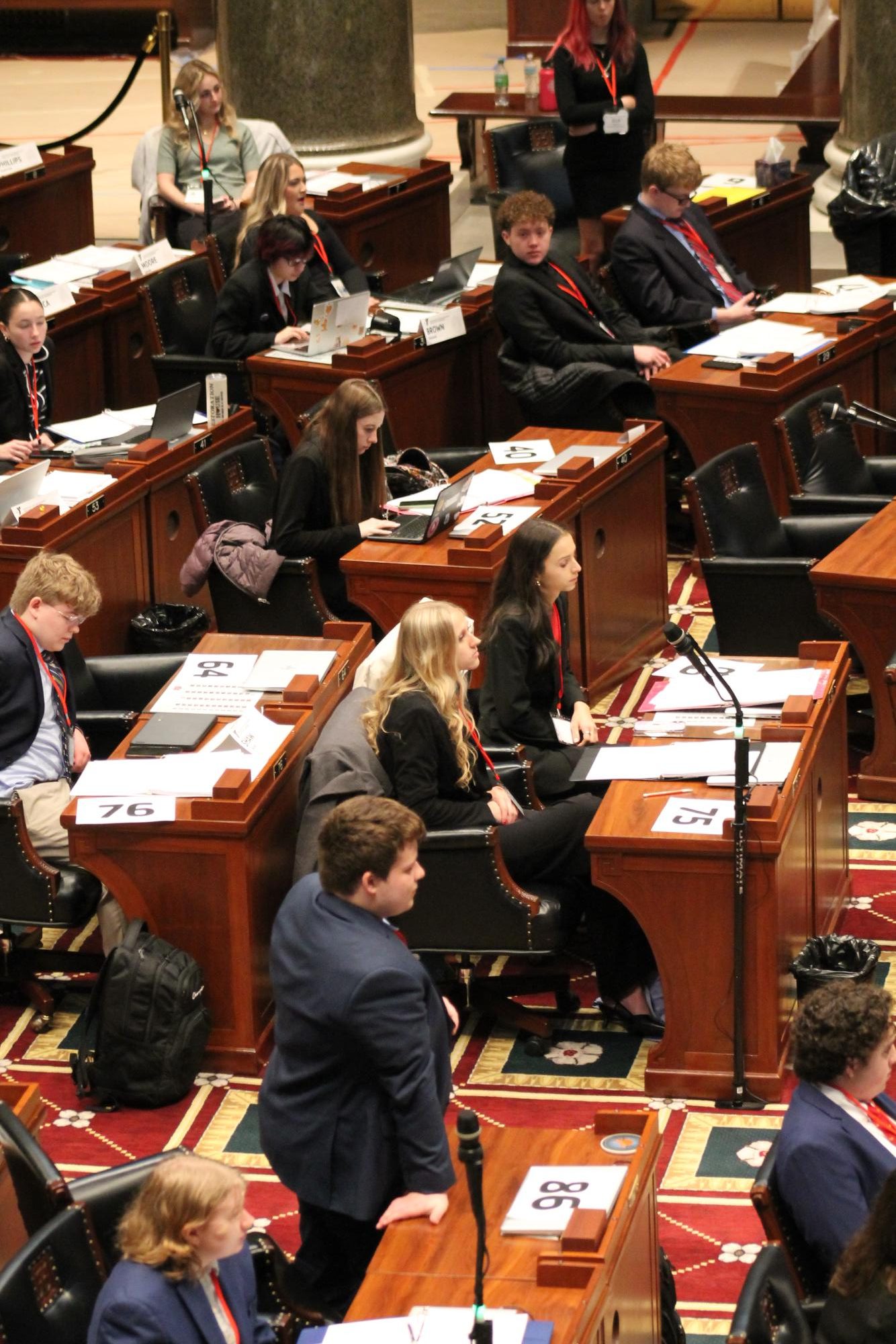 Oakville's delegation prepares to present their bills in the legislative branch. "My experience with YAG has been nothing but positive. Our sponsors are super supportive and definitely set us up for success. Everyone in the delegation grows super close, especially when we go on the trip, and we become one big family," Natalia Lucca (11) said. Students voted on the proposed bills to decide whether or not they would be signed into YAG law.