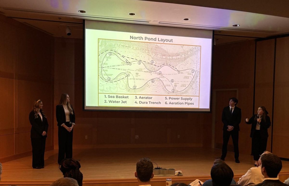 Along with other classmates, Chloe Clark (12) presents her CAPS PM presentation of their solution to reduce algae in the north and south reflection ponds at the Saint Louis Arch at Washington University in the McKelvey engineering building on Saturday, Nov. 15, 2025 for the Gateway Arch National Park Engineering Contest. “It was exciting to show what we had been working on for two months in front of engineers at an esteemed college,” Clark said. The CAPS PM team's solution won third place out of seven teams. 
