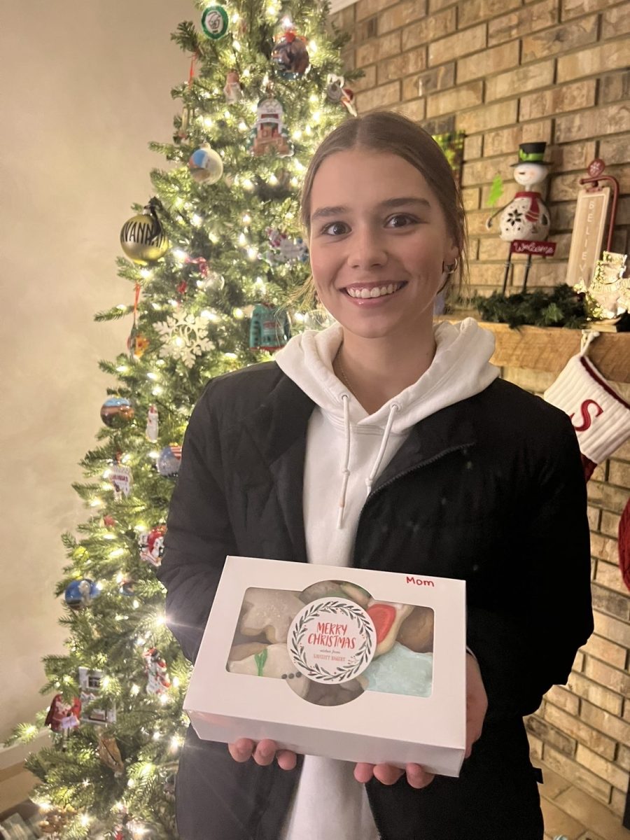 Savannah Hanak (12) and her dad bake cookies during the holiday season. “We look forward to it every year … because it brings holiday cheer to everyone,” Hanak said. They have been doing this since they were little and plan to keep the tradition going. 