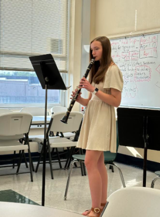 Paige Smith (9) performs a song while playing her clarinet at the Oakville Middle School in April 2024.  “Another thing I love,” Smith said, “is just getting to prepare music for concerts and performing.” Smith got a two, the second best score she could get, in her solo at a solo and ensemble contest for band in seventh Grade.