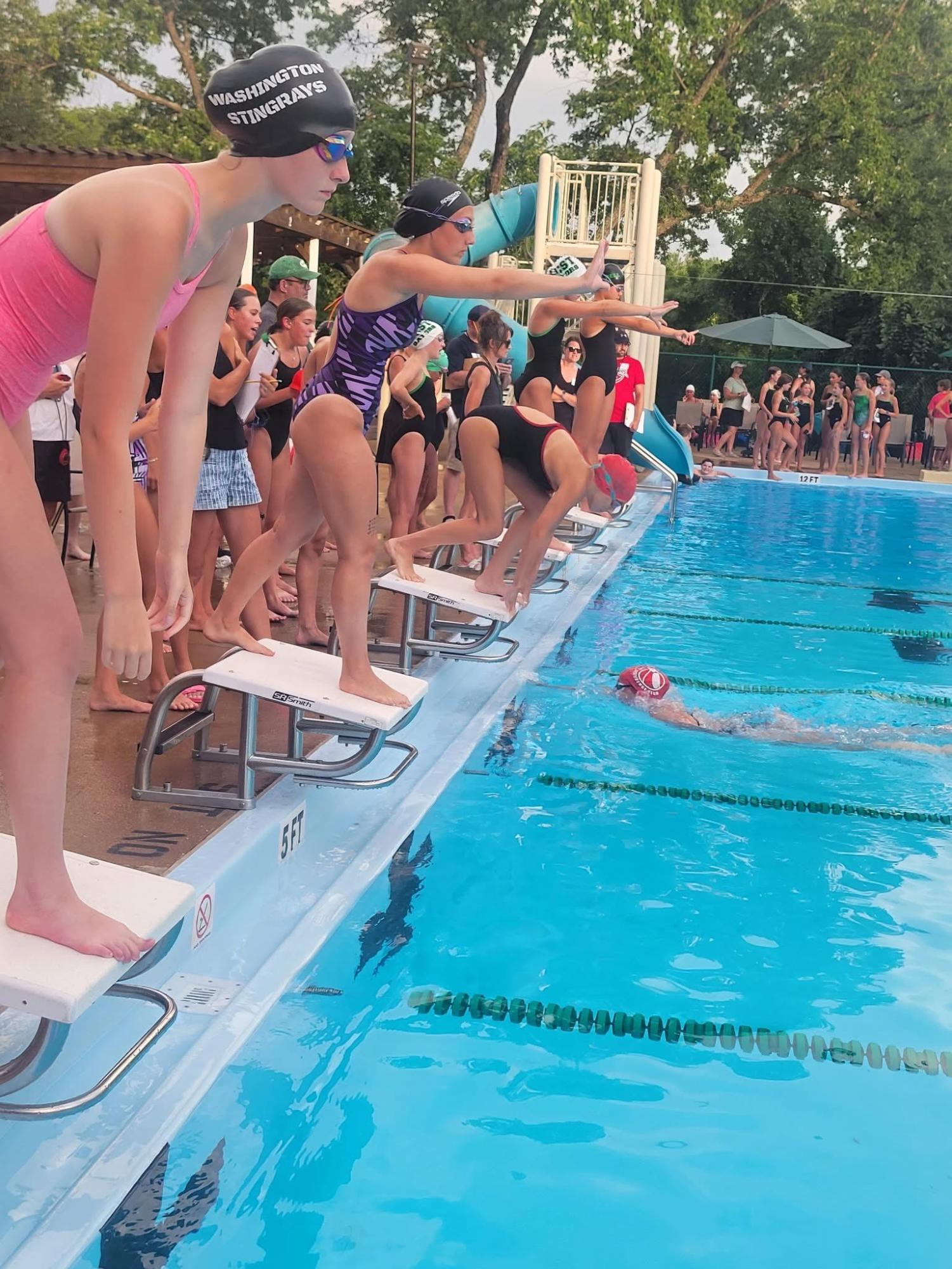 Sophia Ray (9) prepares to dive into the swimming pool for a race on July 2, 2025. “I've always enjoyed swimming because I am pretty good at it and it's a common sport once you get the hang of it,” Ray said. “I like my team that I have and usually the coaches are pretty nice.” Ray believed swimming could be a great way to connect with others as well as a fun sport once you understood it. 