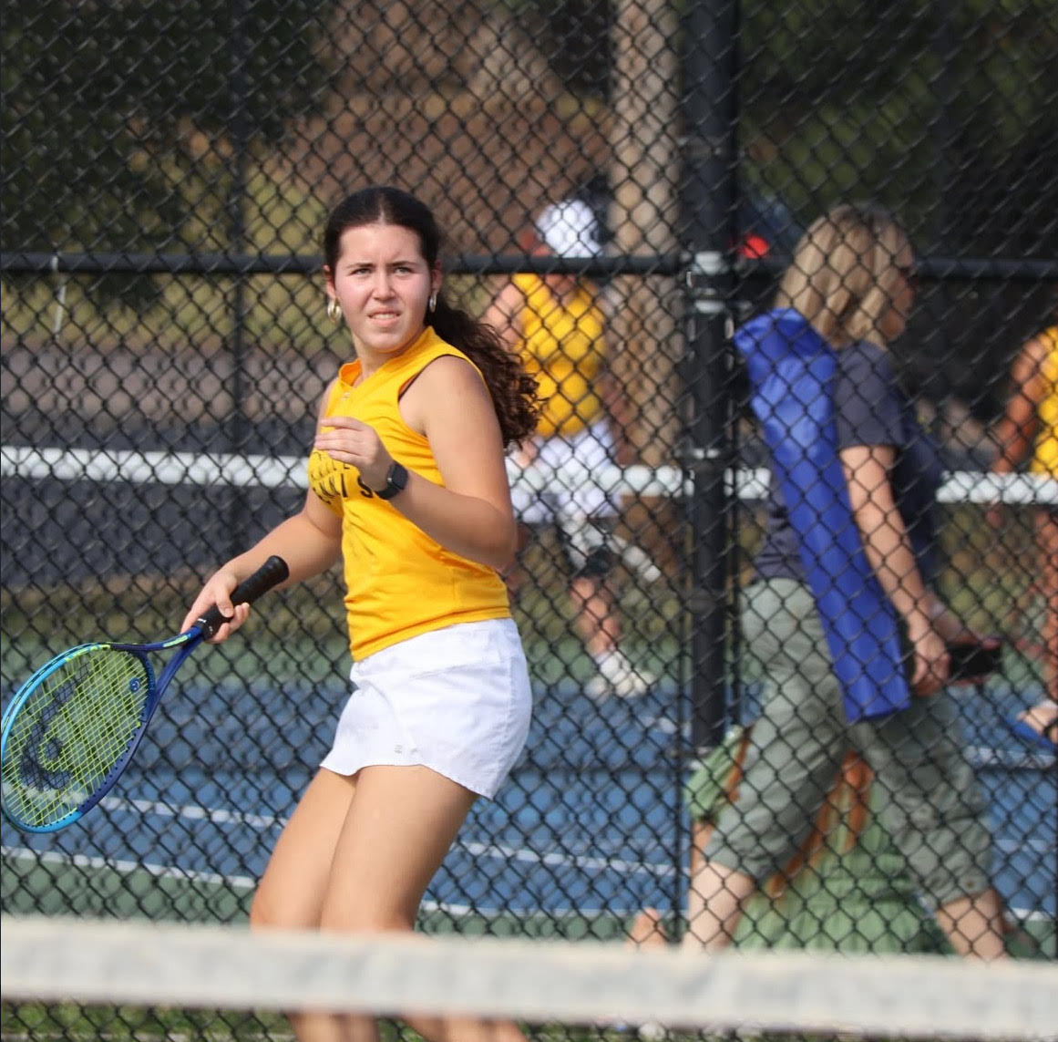 Ajla Ramic (10) swings hard on Oct. 6, as she practicing for her upcoming game. “I love this feeling. The adrenaline of the match is exactly why I play,” Ramic said. She was hitting back and forth with a partner to warm up. 