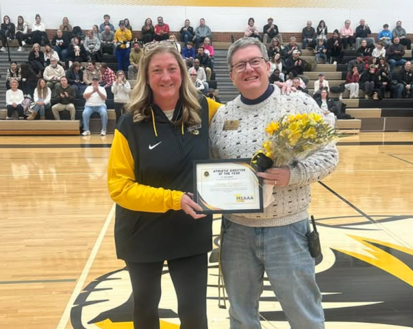 Athletic director Becky Czuppon and principal Brian Brennan pose for a photo. "I knew I had been nominated. There were three or four of us that were on the list and I didn't think about it twice, and I got a text. I was like, 'Oh, look what happened,'" Czuppon said. Czuppon has been an activity director for 19 years.